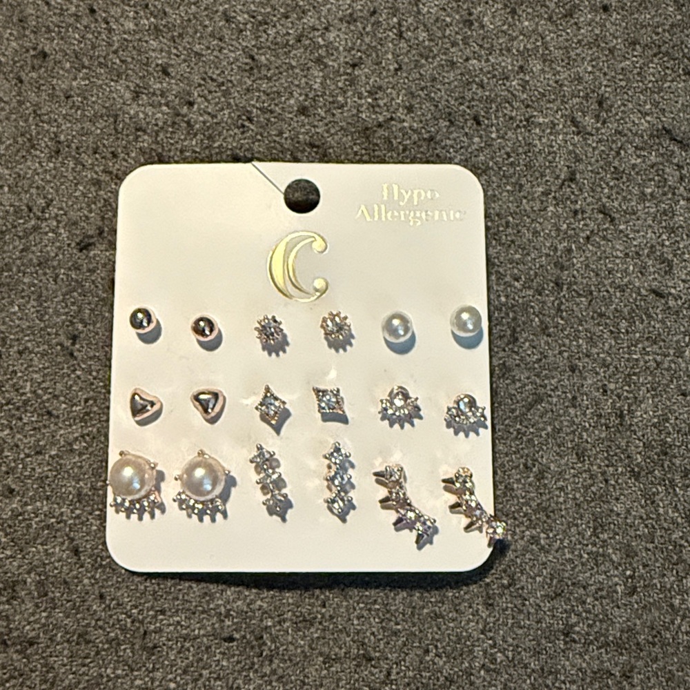 Charming Charlie set of 9 earrings, NWT.